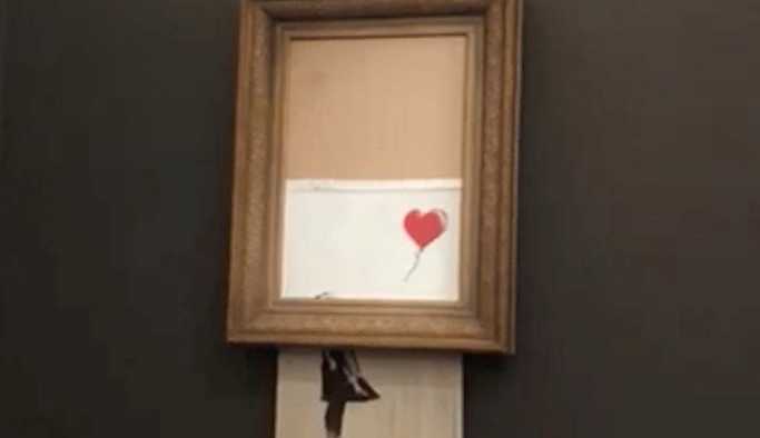 Banksy'nin 'Balonlu Kız' adlı eseri kendini parçalara ayırmasına rağmen satıldı