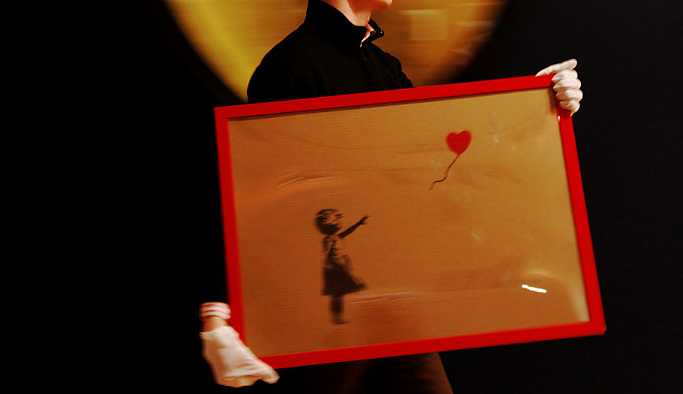 Banksy'nin eseri yaklaşık 1 milyon sterline satıldıktan sonra kendi kendini yok etti